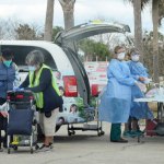 Flagler County Health Department staff providing Covid-19 testing to 100 people at the Flagler County Airport grounds this afternoon. See next week's testing schedule below the story. (© FlaglerLive)