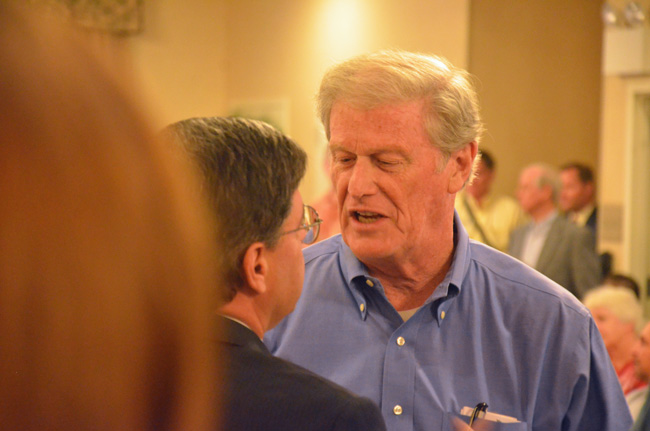 I'll be seeing ya: John Thrasher talking to County Commissioner Nate McLaughlin in early August. (© FlaglerLive)