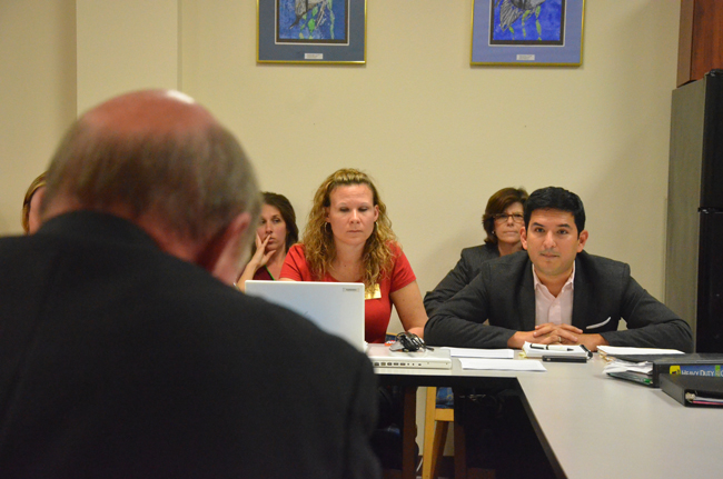 Will Vargas, right, of the Florida Educators Association, the teachers union, and Katie Hansen, president of the Flagler County Educators Association, during a bargaining session as they faced Jerry Copeland, the district's lead negotiator, last year. (© FlaglerLive)