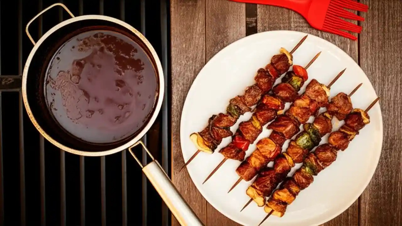 A saucepan of boiled leftover braai marinade next to a platter of grilled meat, showing how to safely reuse it as a sauce.