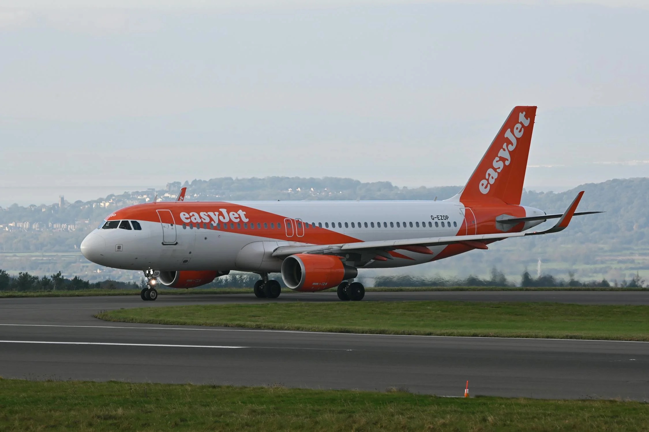 easyJet Airbus A320 taxiing at Bristol Airport during daylight