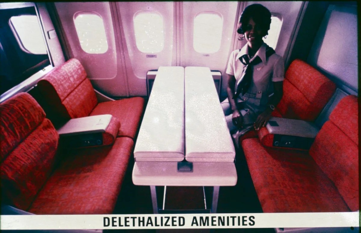 Delethalized amenities, cabin face to face seating with folding tables