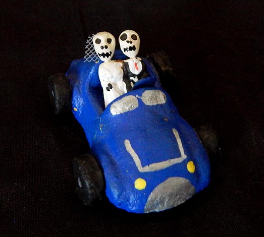 Decoration for Day of the Dead (honors ancestors)-Latin America-Aztec/Spanish heritage-Papier mache with wheels-2 1/2" long
