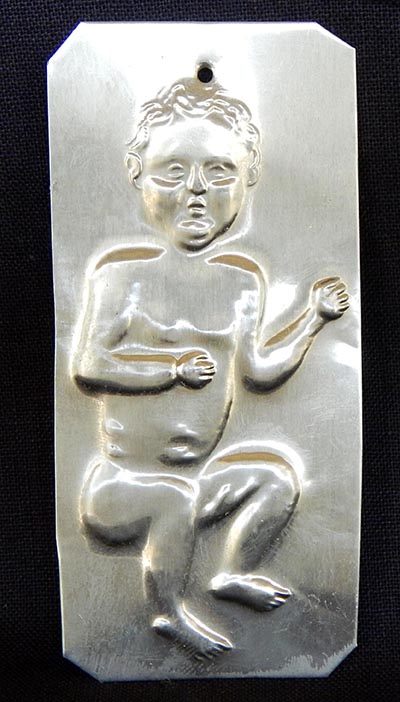 Affixed to saint-Requests cure for child/Gives thanks for child's cure-Mexico/USA-Roman Catholic/Latino-Tin-3" x 1 1/4"