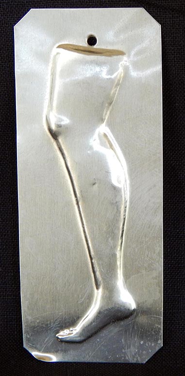Affixed to saint-Requests right leg cure/Gives thanks for right leg cure-Mexico/USA-Roman Catholic/Latino-Tin-3" x 1 1/4"