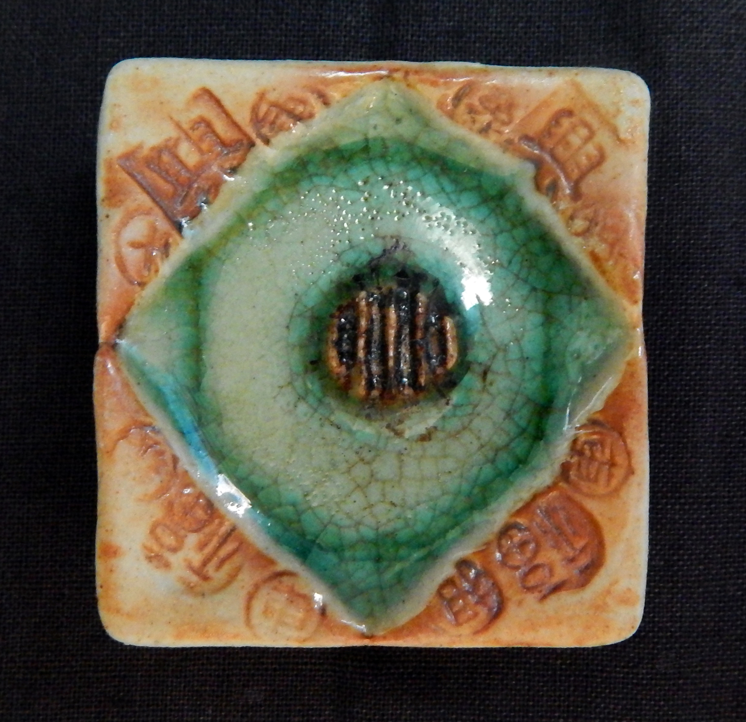 Purification of environment-China-Chinese, Buddhist, and Hindu?-Ceramic/Glaze-1 3/4" x 1 3/4"