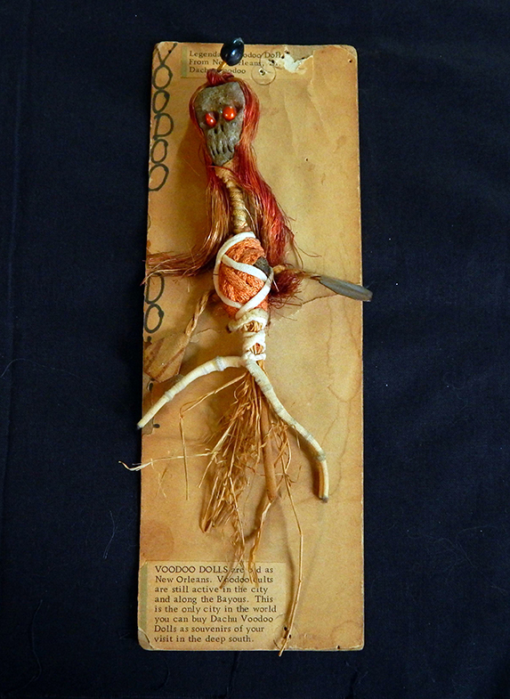 Inflicts harm on humans by sticking pins on the doll that represents places on enemy's body-New Orleans, Louisiana, USA/Caribbean-Afro/Caribbean-Pipe cleaner, straw, thread, beads, and stone-7" long