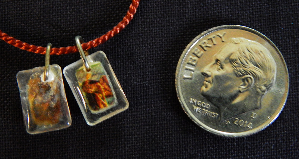 Worn for protection and blessings. Dedicated to various saints denoted by different colors-Global-Roman Catholic-Orange cord/Metal/Plastic- 1/4" each