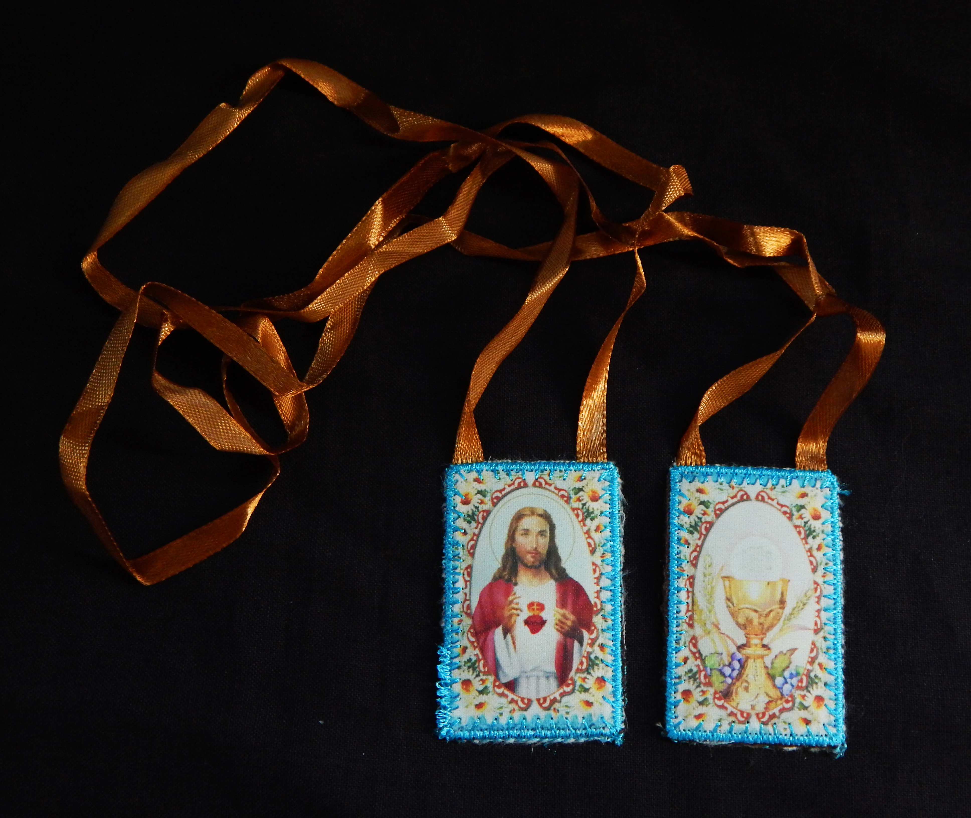 Worn for protection and blessings. Dedicated to various saints denoted by different colors-Global-Roman Catholic-Cloth/Thread/Ribbon-27" long-each scapular 2 1/4" x 1 1/2"