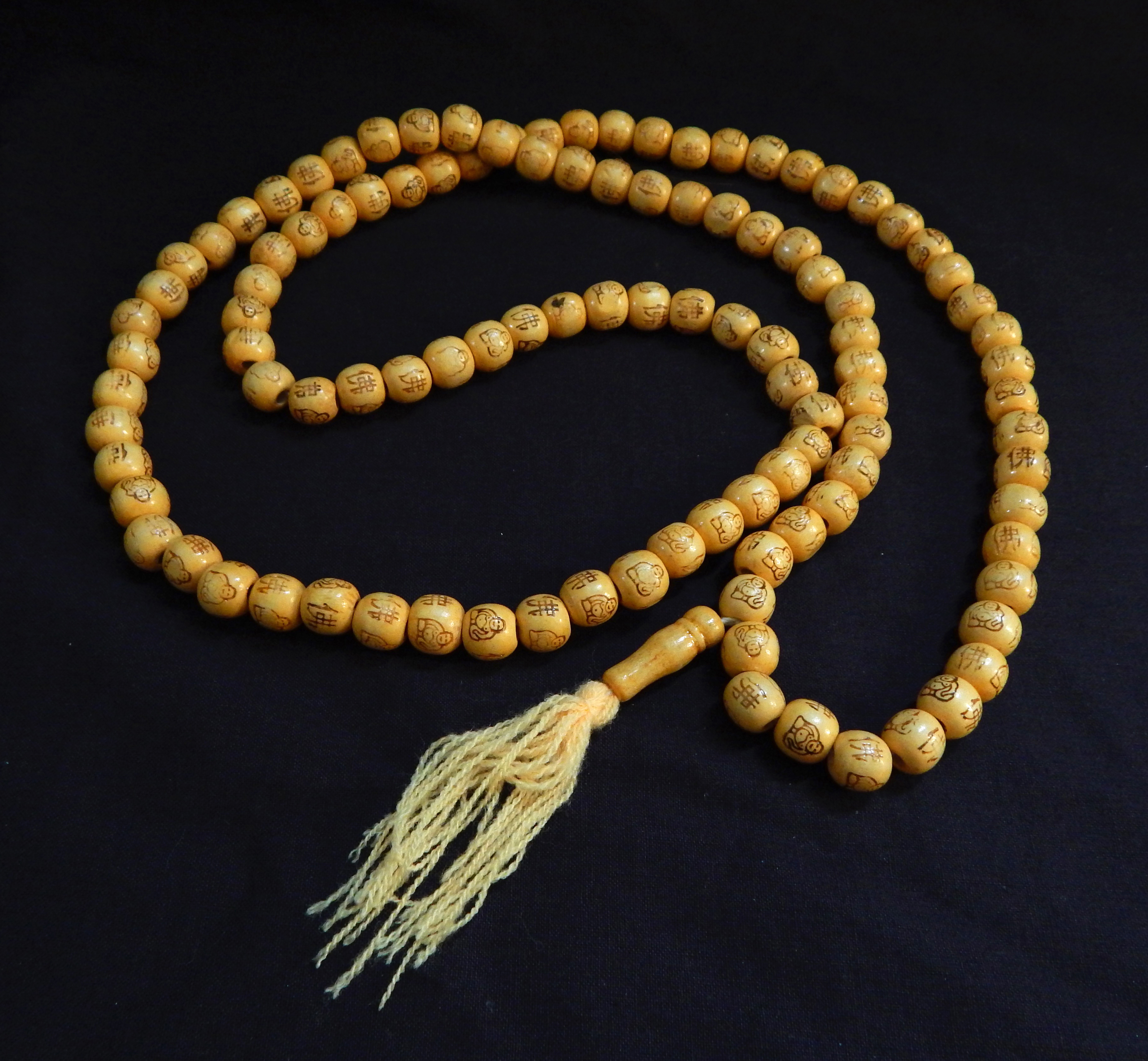 Prayer counter, meditation-Tibet-Buddhism-108 wooden beads with design and tassel-31" long-each bead 1/4"