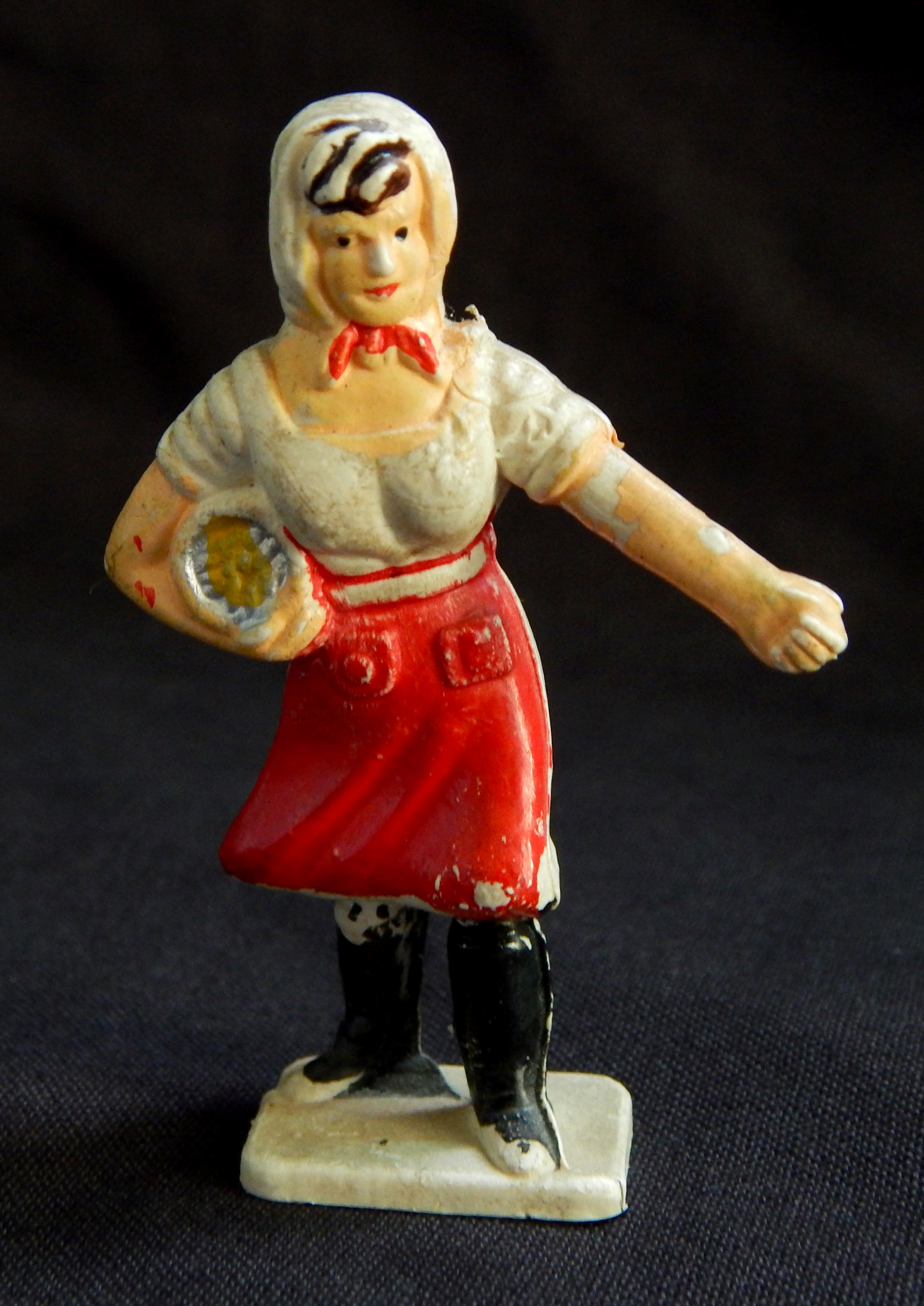 Figure of female peasant sowing seeds