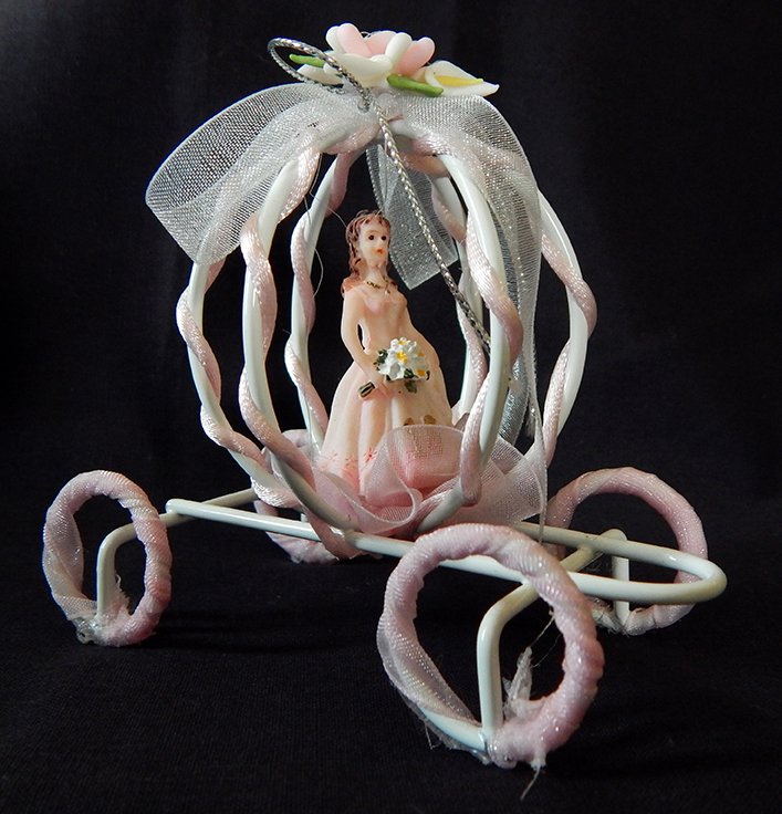 Quinceañera doll in carriage