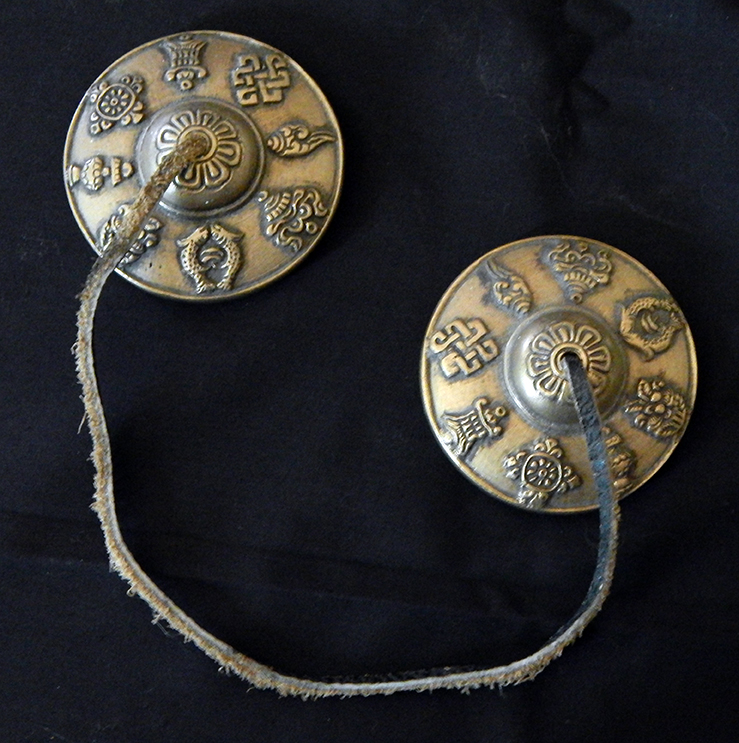 Two connected cymbals