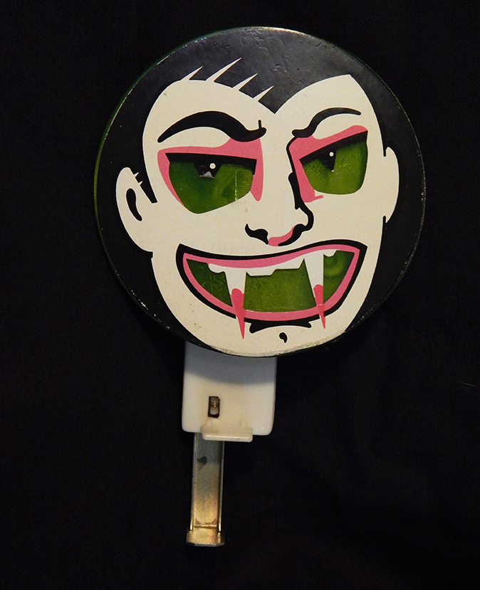 Vampire noisemaker (eyes and mouth glow when lever is pressed)