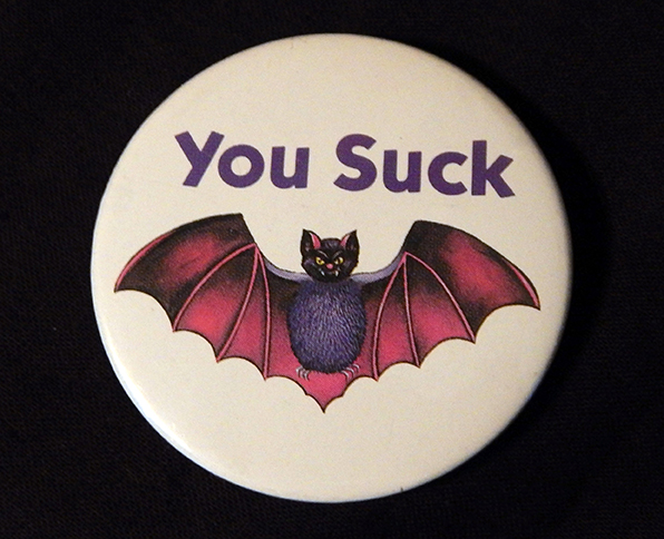 Pin, "You Suck" with drawing of a bat