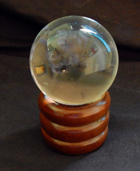 Crystal ball on stand