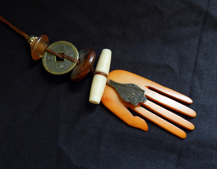 Amulet, Chinese coin, amber beads, hamsa, triangular talisman