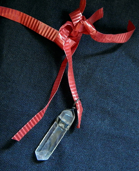 Crystal hanging from ribbon