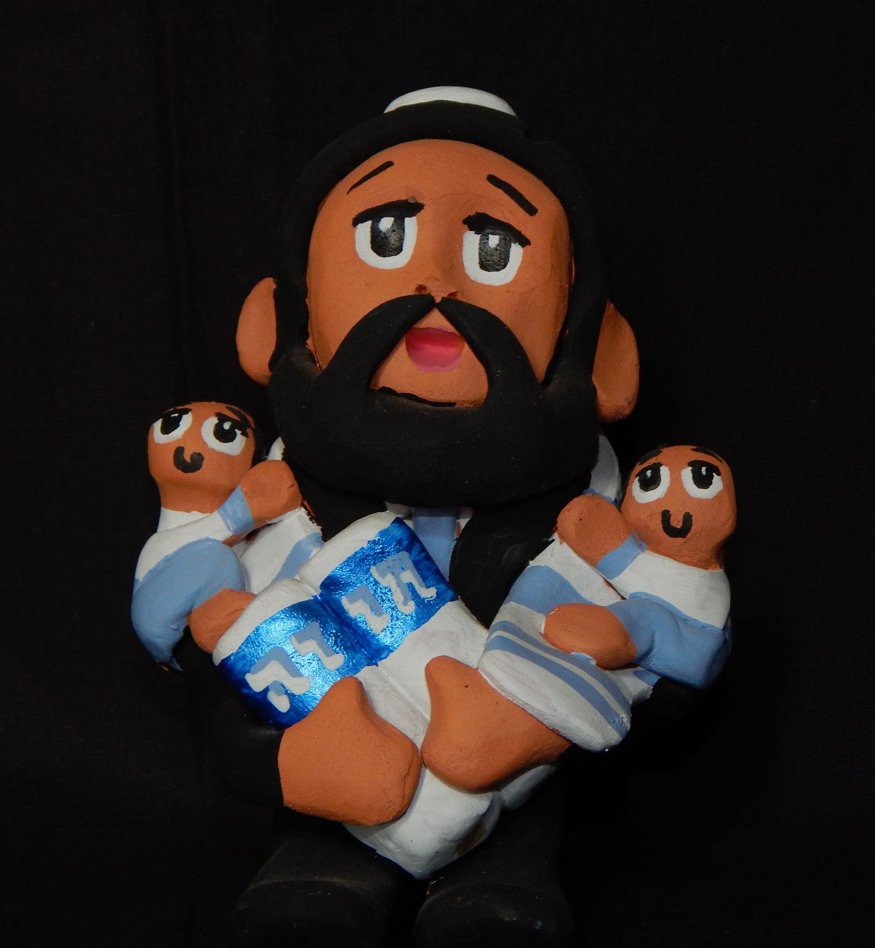 Satire on Pueblo Indian's story teller dolls-Created by a Mexican artist who discovered he may be descended from Crypto Jews