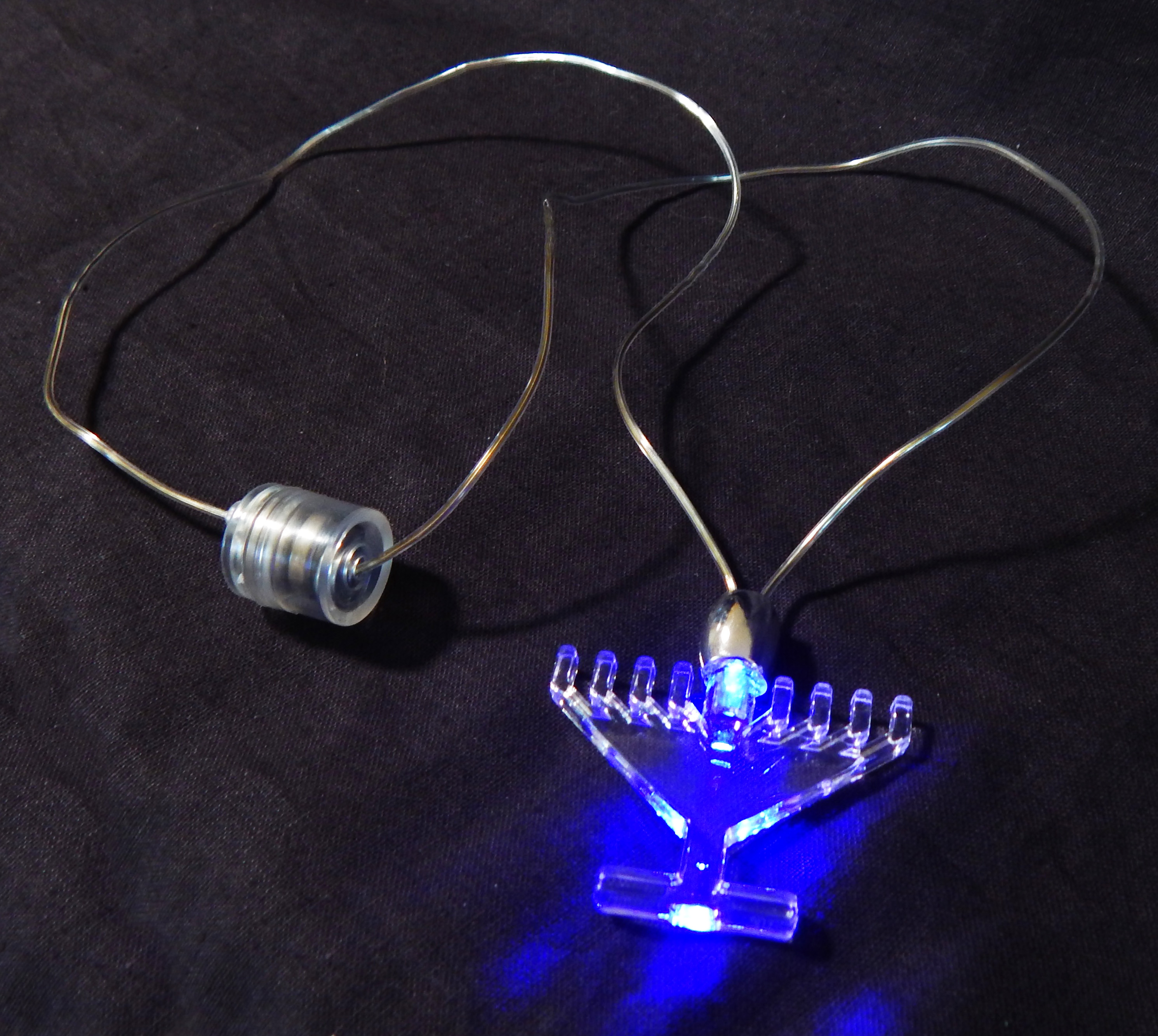 Necklace with battery-lit menorah
