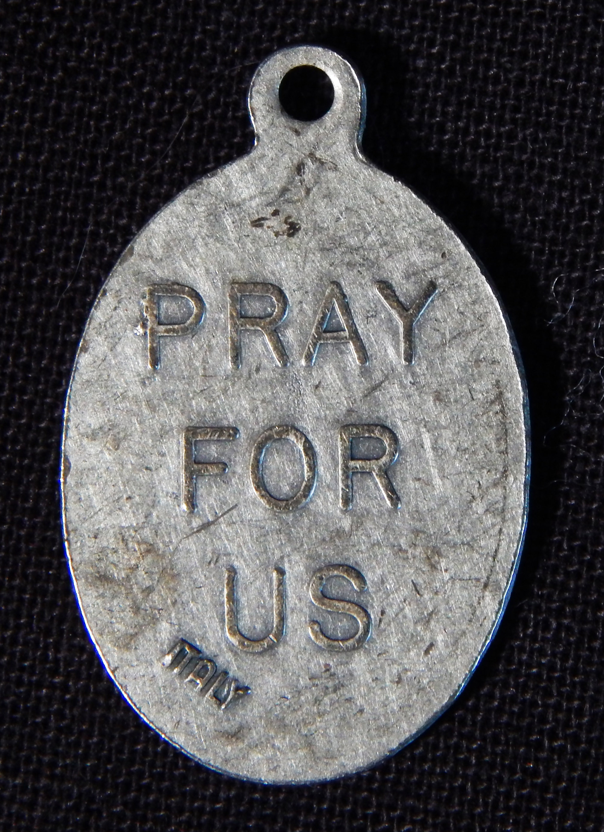 Reverse side of pendant of St. Isidore