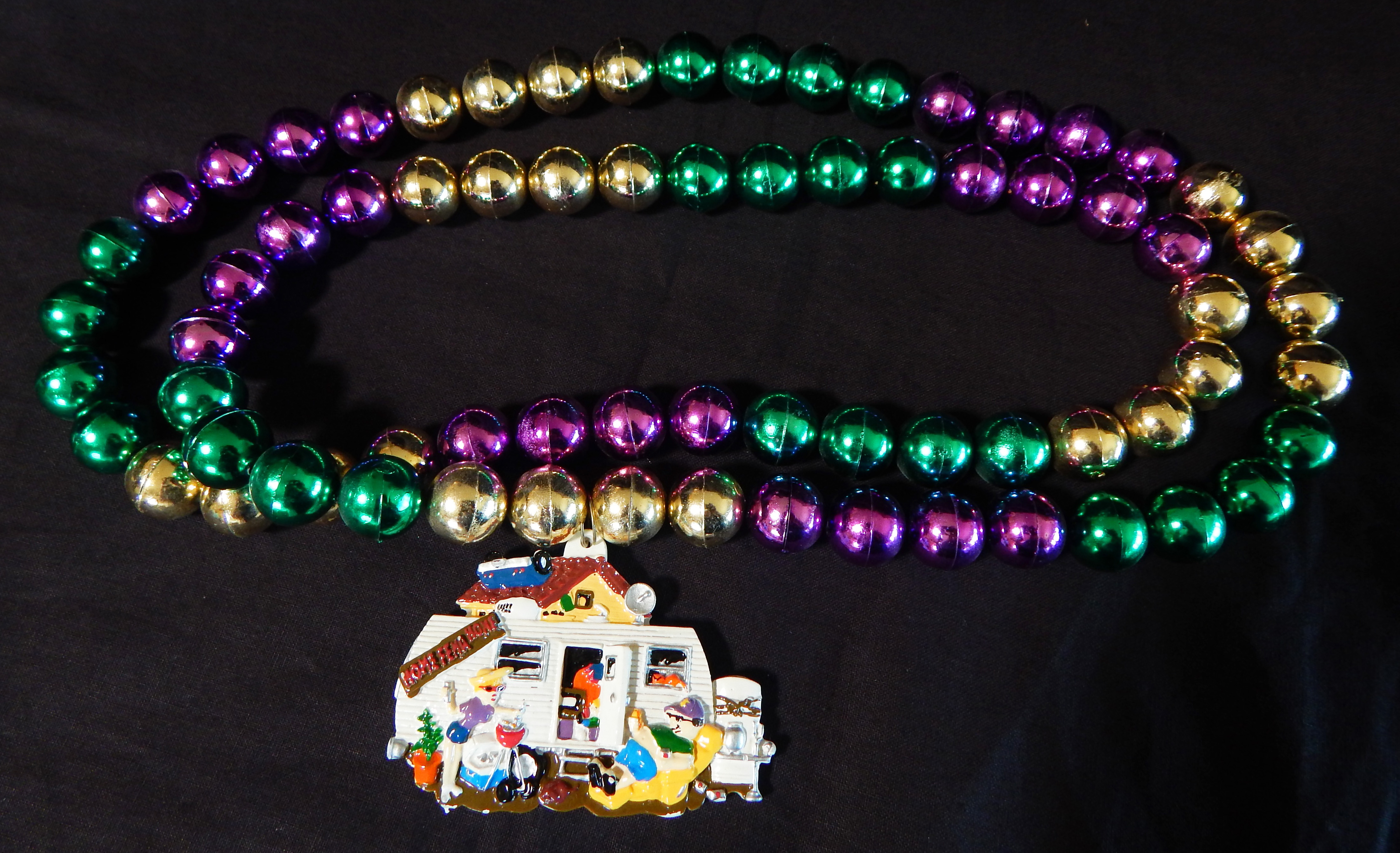 Mardi Gras beads with house trailer pendant