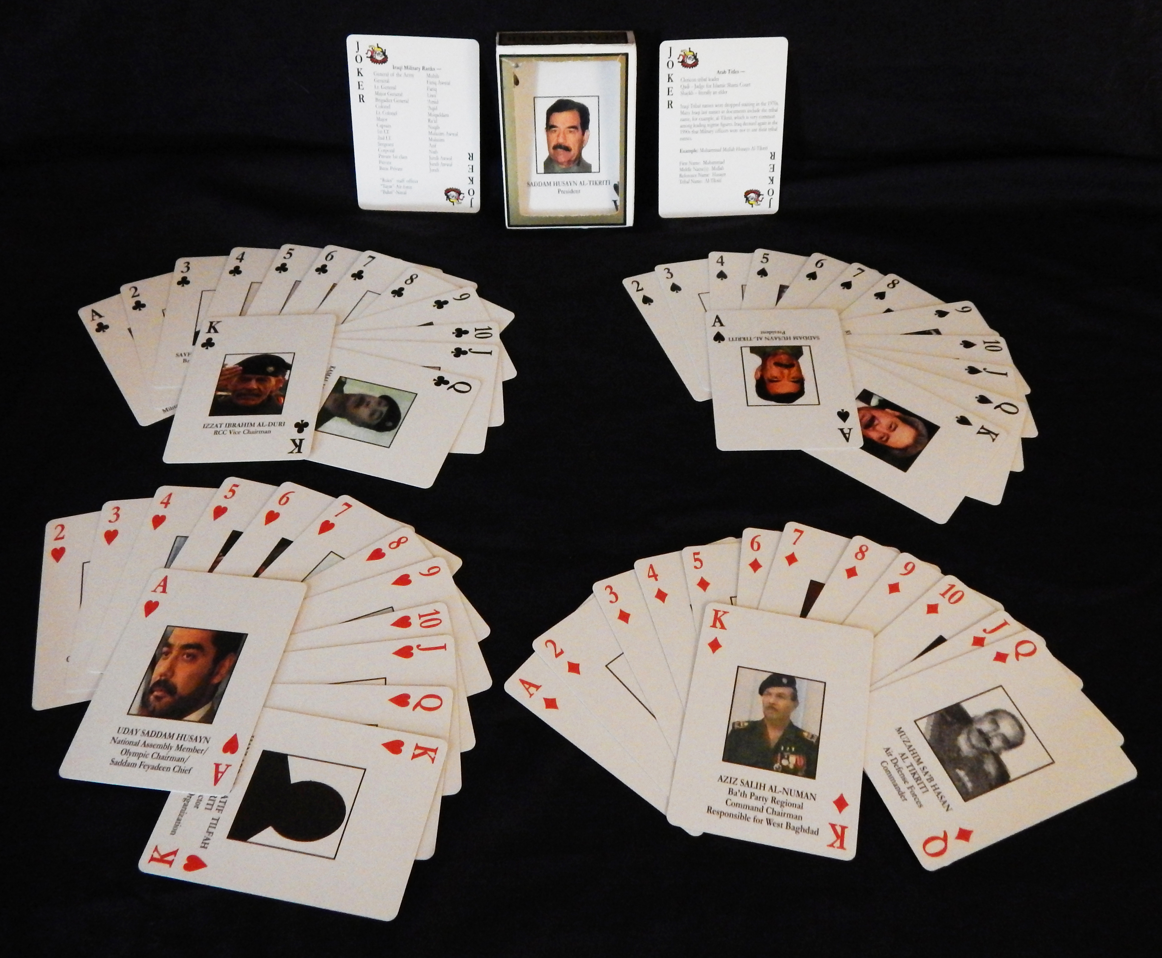 Political satire of the Saddam Hussein Iraqi regime-USA-American/Popular culture-Laminated Paper/Ink-3" x 2 1/2"