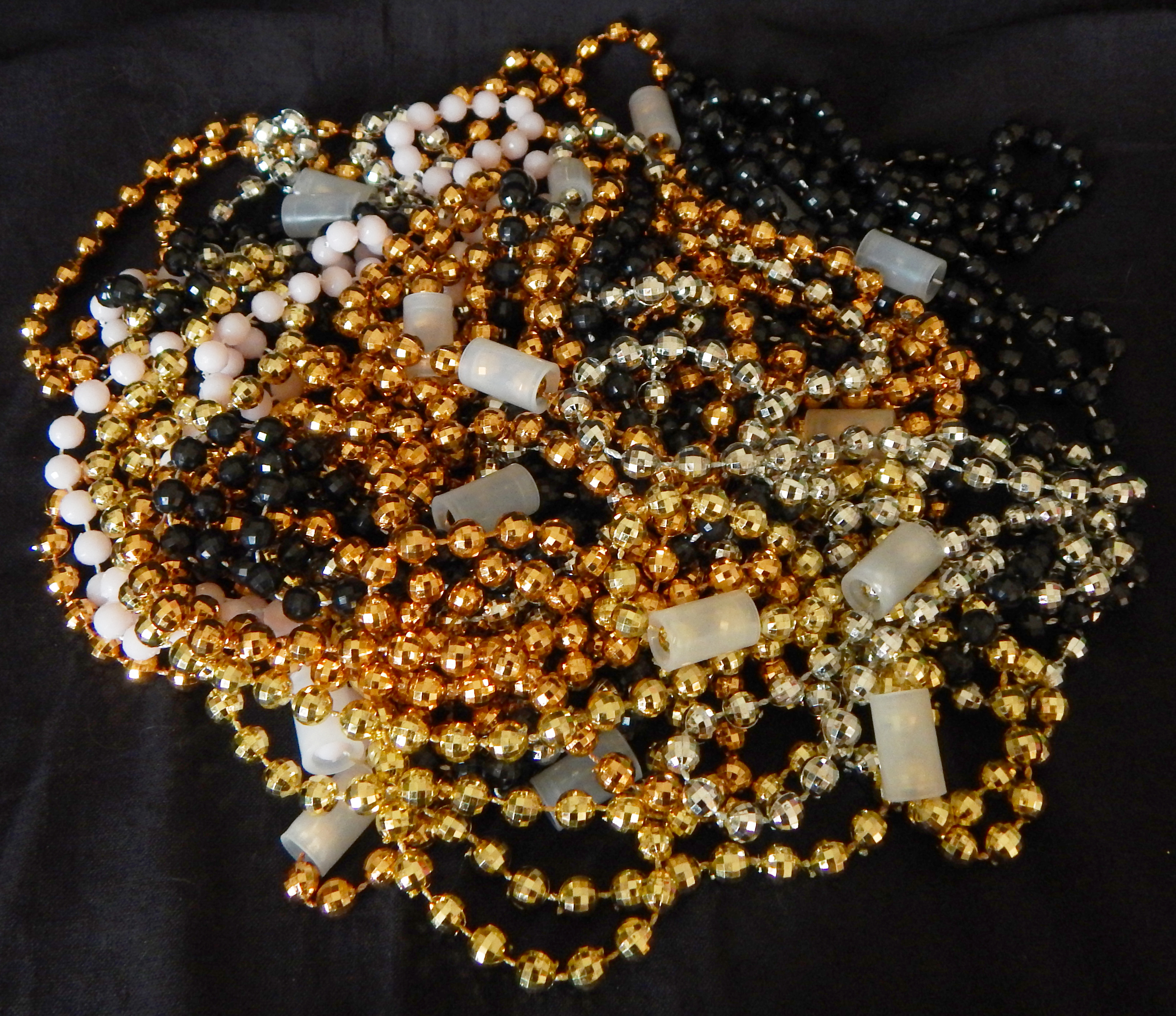 Thrown from floats to revelers on the streets; Last celebration before Lent and the ensuing serious Easter celebration