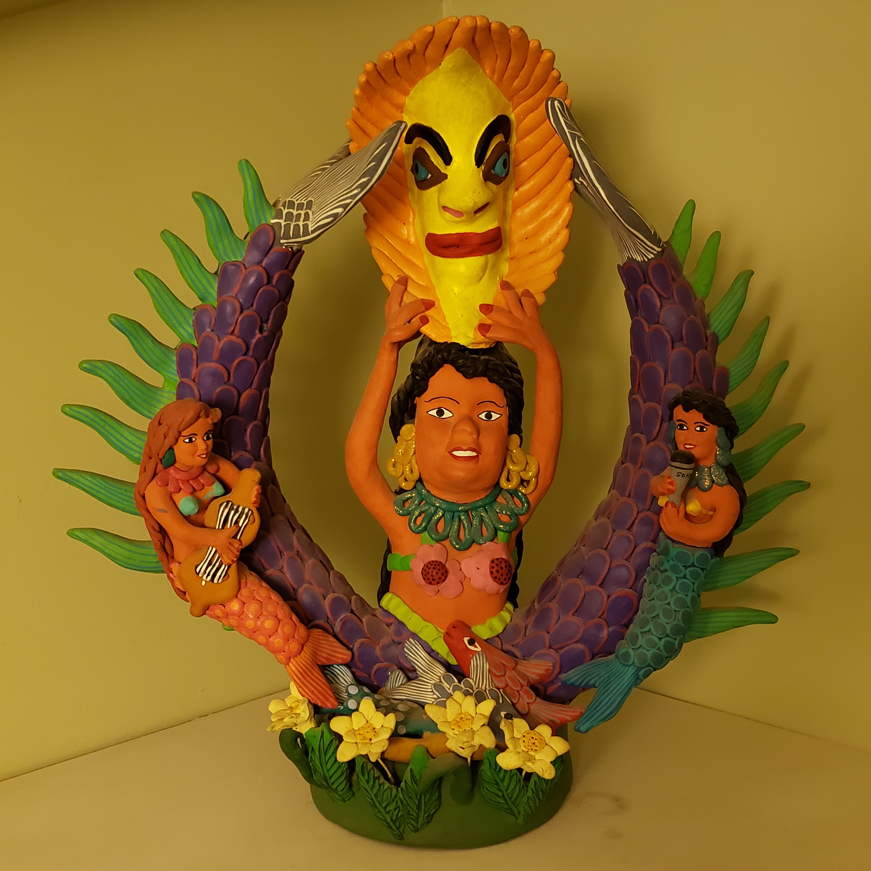 2007 17” tall x 16” wide Artist: Narcisco Lucas de Ocumicho, Michoacan, Mexico Material: ceramic Mermaids (sirenas) are part of the music, art, and culture of Mexico. They are goddesses of the sea, not in the sense that they are religious deities or cultural gods, but in folkloric form.