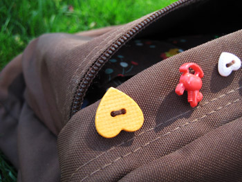 buttons sewn on my backpack