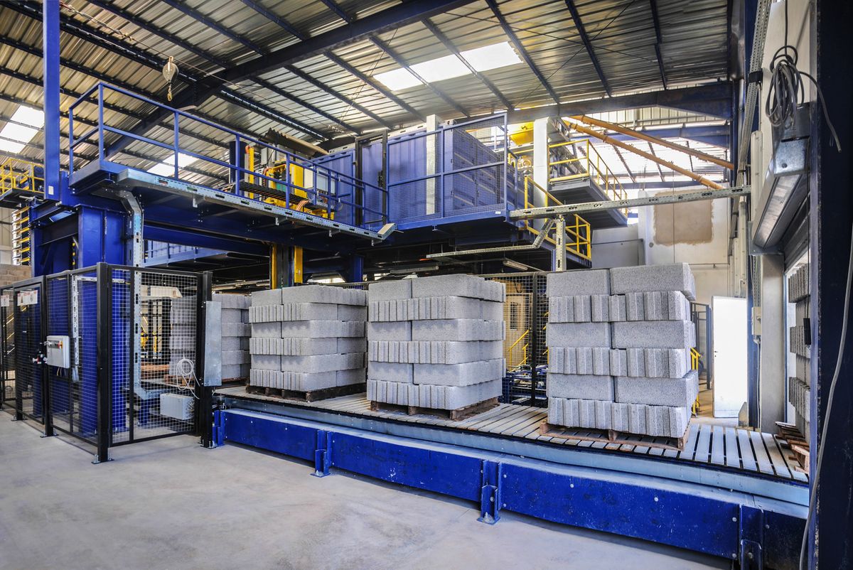 Fully automatic concrete block and paver making machine by Maxstone Industries