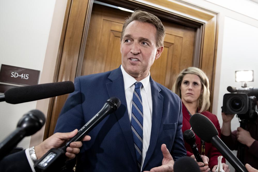 FILE - In this Dec. 6, 2018 file photo, Sen. Jeff Flake, R-Ariz., speaks with reporters on Capitol Hill in Washington, Thursday, Dec. 6, 2018. President Joe Biden on Tuesday nominated former senator Jeff Flake to serve as ambassador to Turkey. The Republican had endorsed Biden's 2020 run for the White House (AP Photo/J. Scott Applewhite)