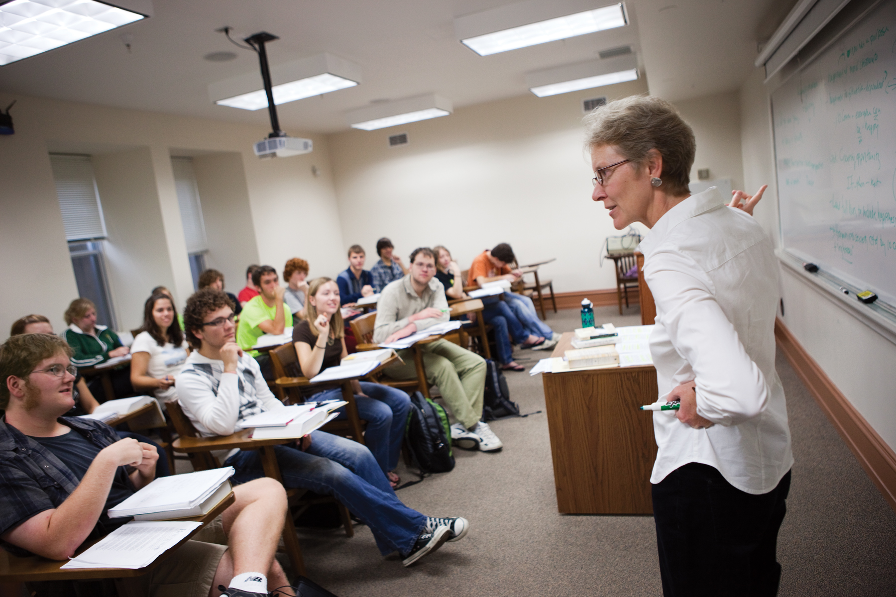 A college classroom taught by a woman professor