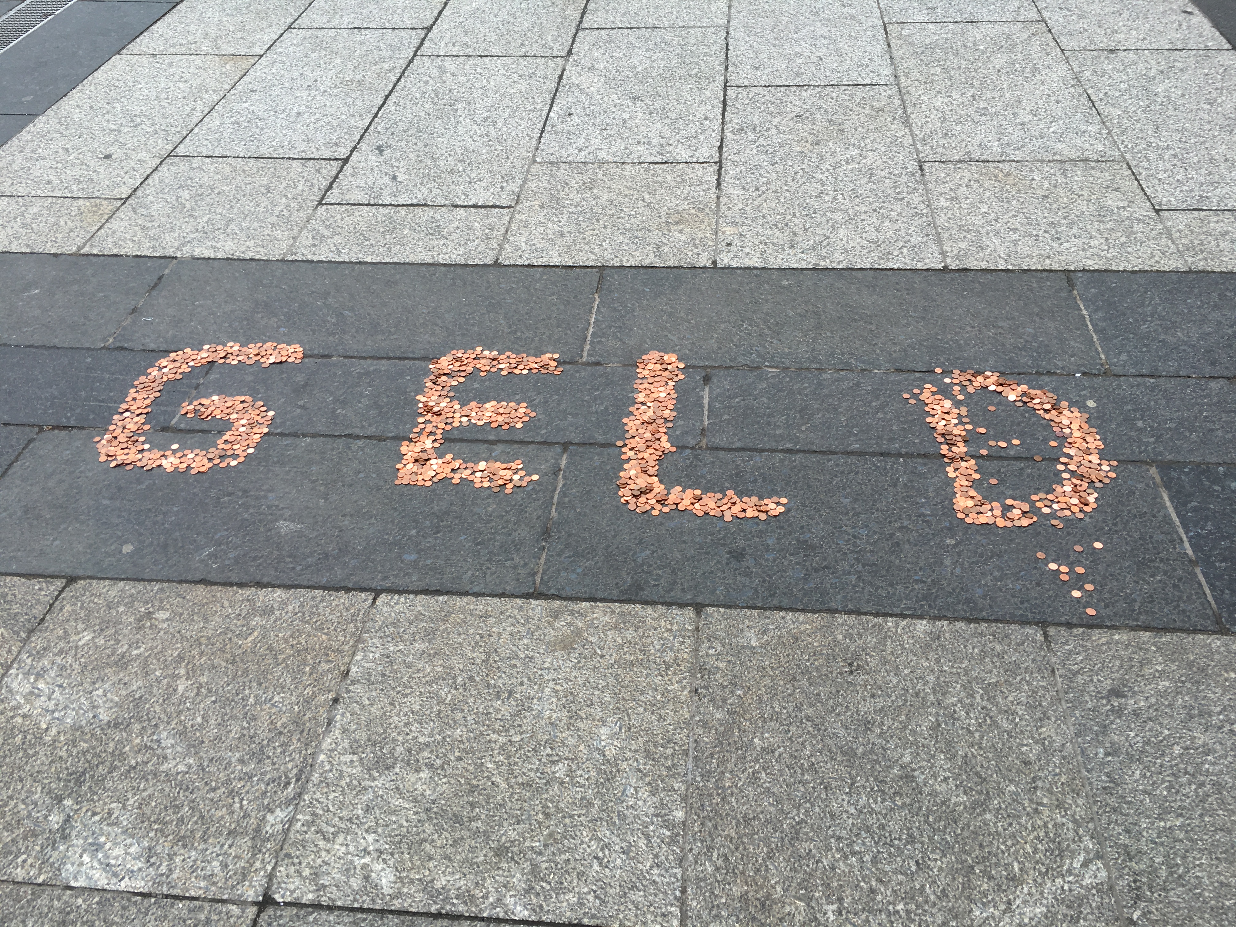 "Money" written in pennies
