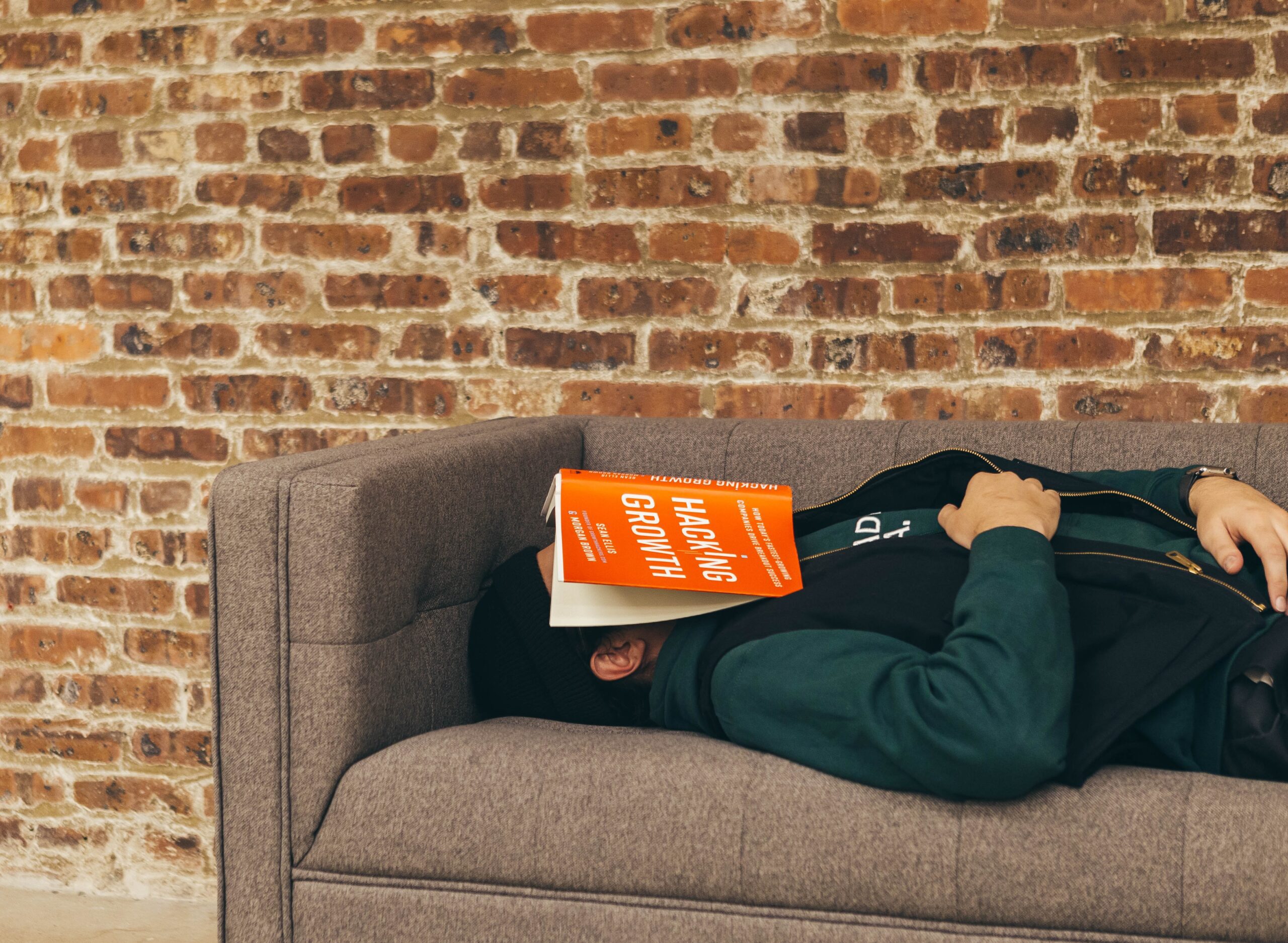 Growth hacking book on man on couch