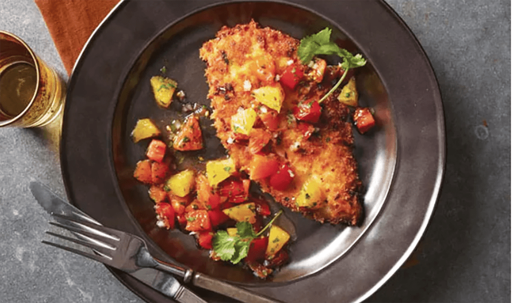 These pork cutlets are breaded in a mixture of dried bread crumbs, orange zest, thyme, orange juice, and salt and pepper. After frying in grape seed oil, they're topped with a feisty orange salsa.�