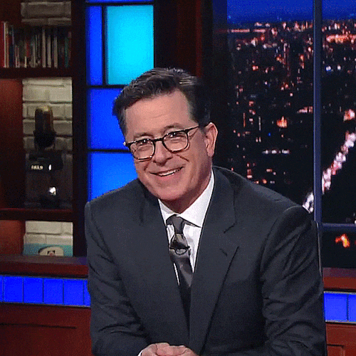 stephen colbert smirk laughing