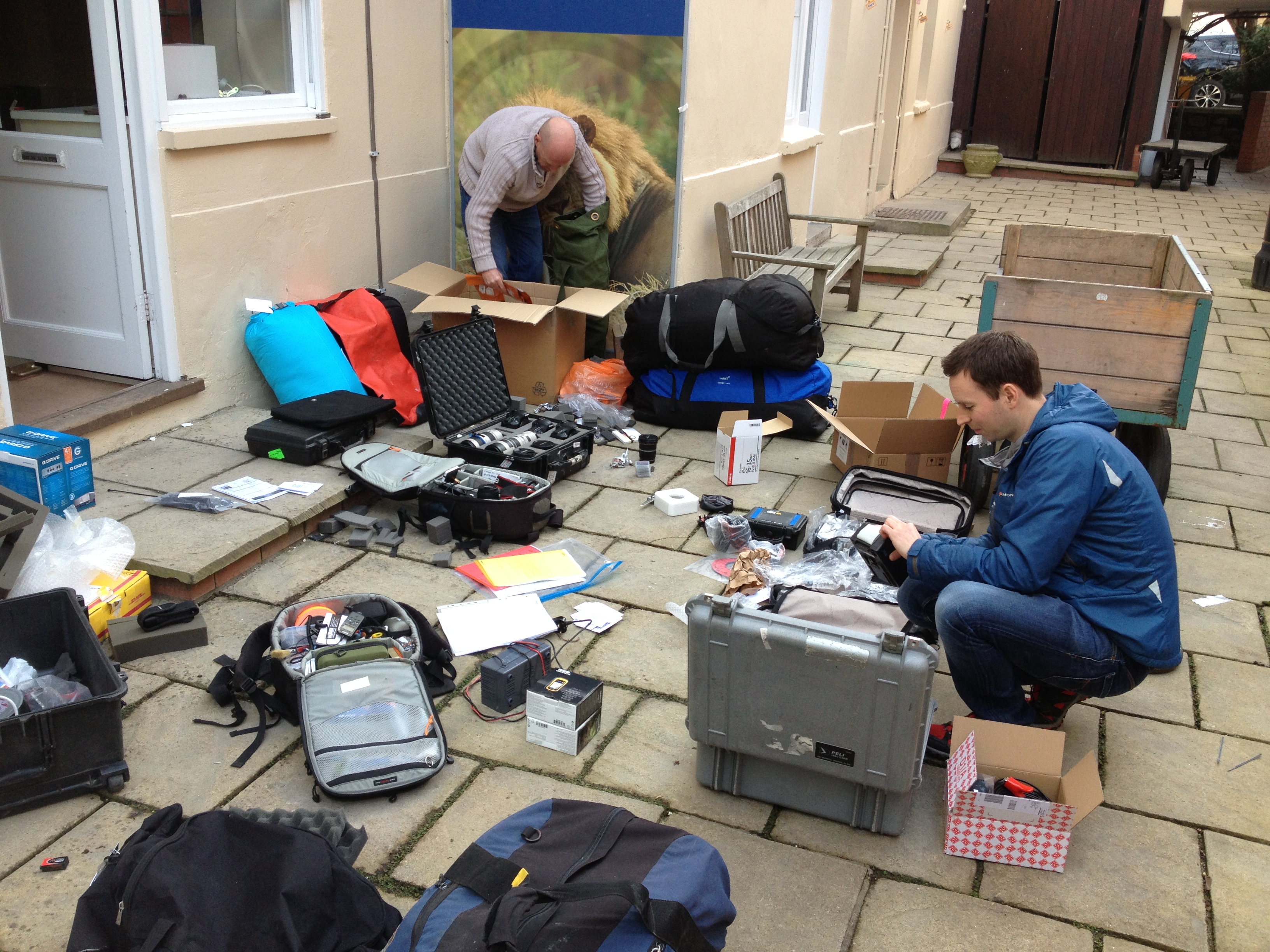 Neil, Andy, kit packing. Notice Andy hiding fishing gear in the kit!