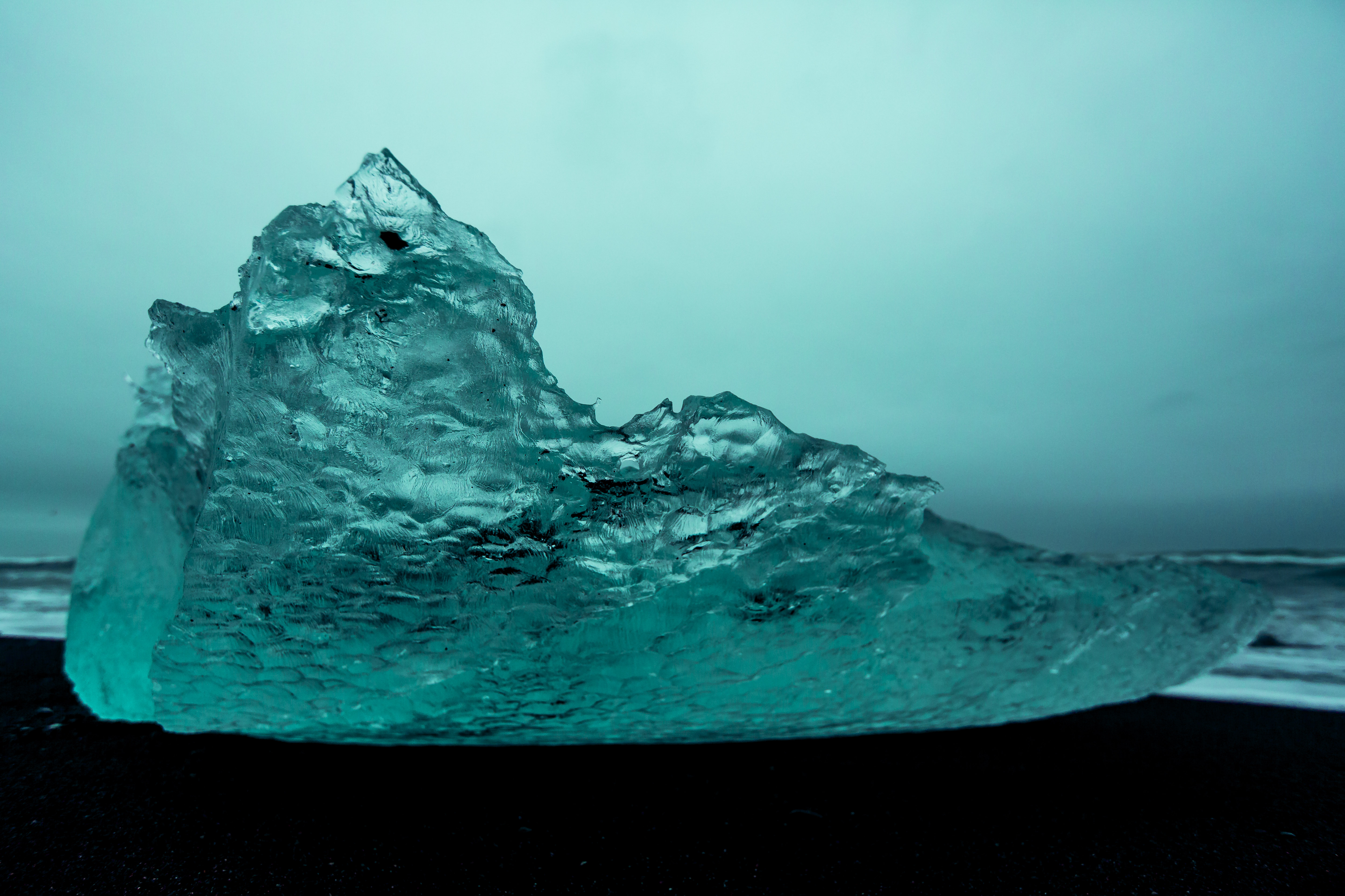 Iceberg on black volcanic beach Canon
