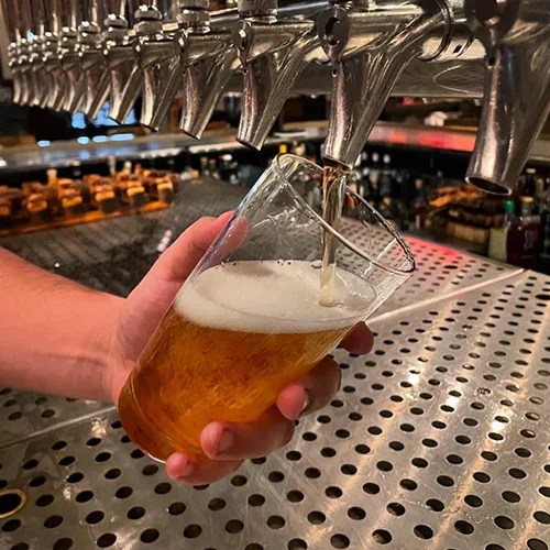 Botanical beer being poured at Forbidden Root