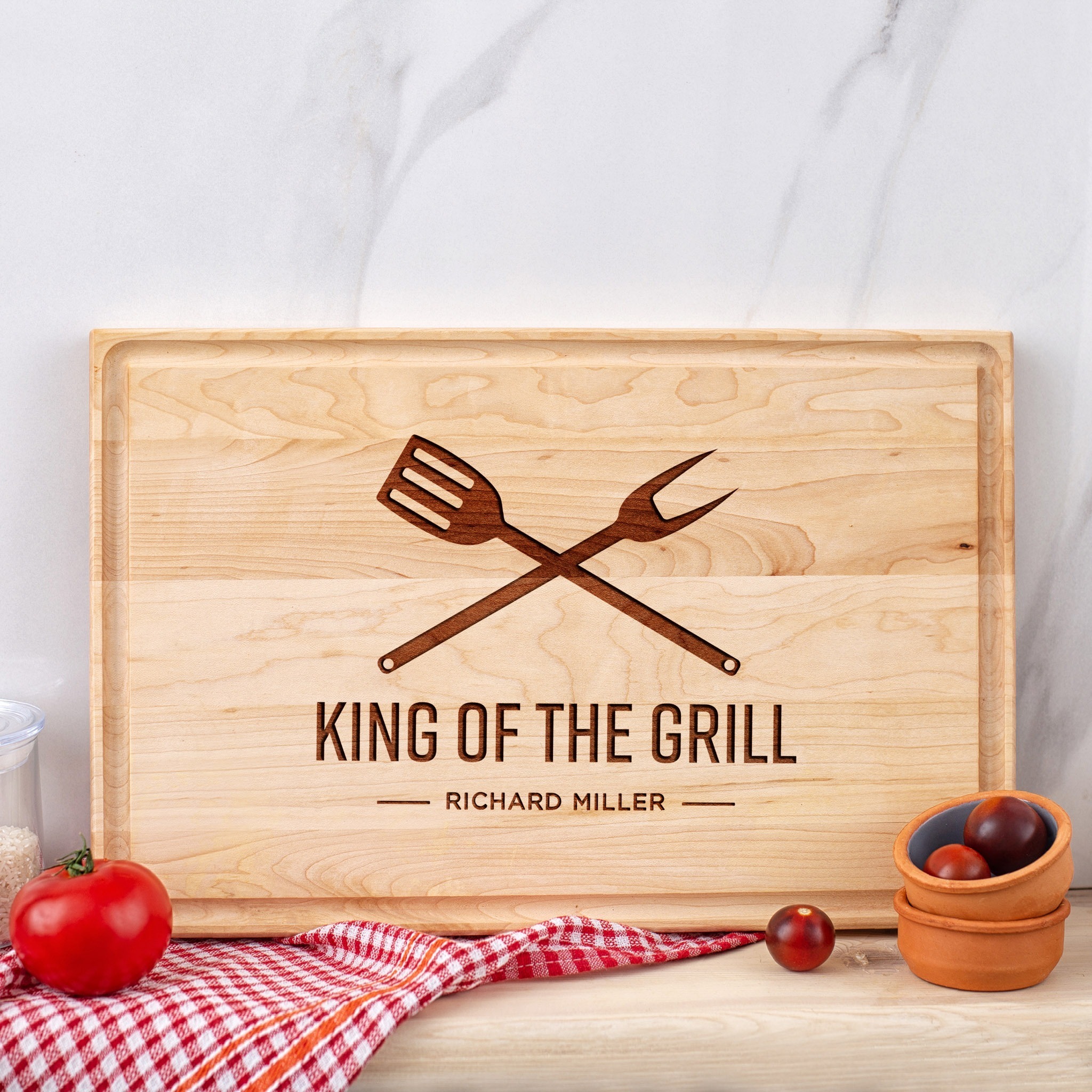 King of the grill personalized cutting board.