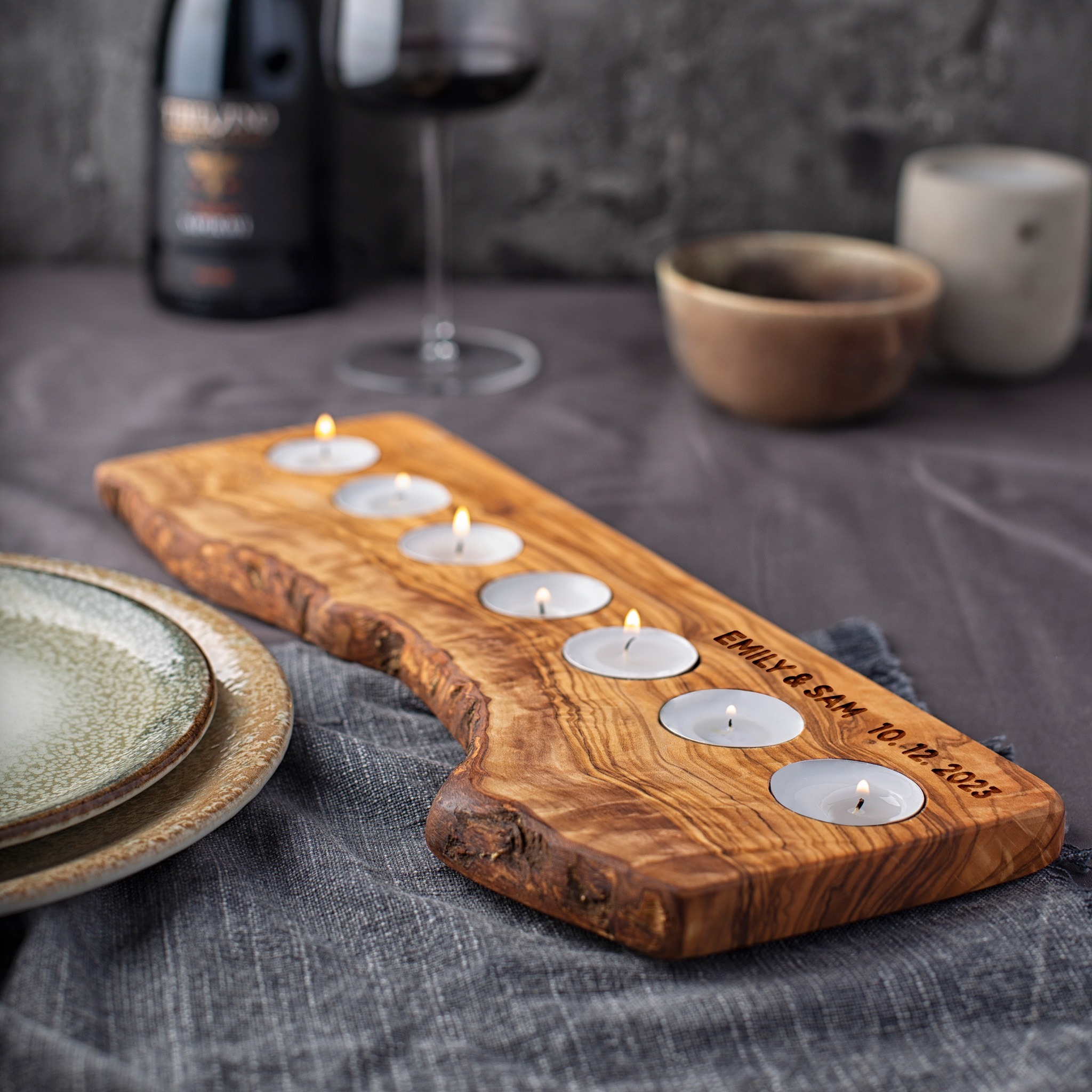 wooden candle holder made out of olive wood with 7 tealight candles
