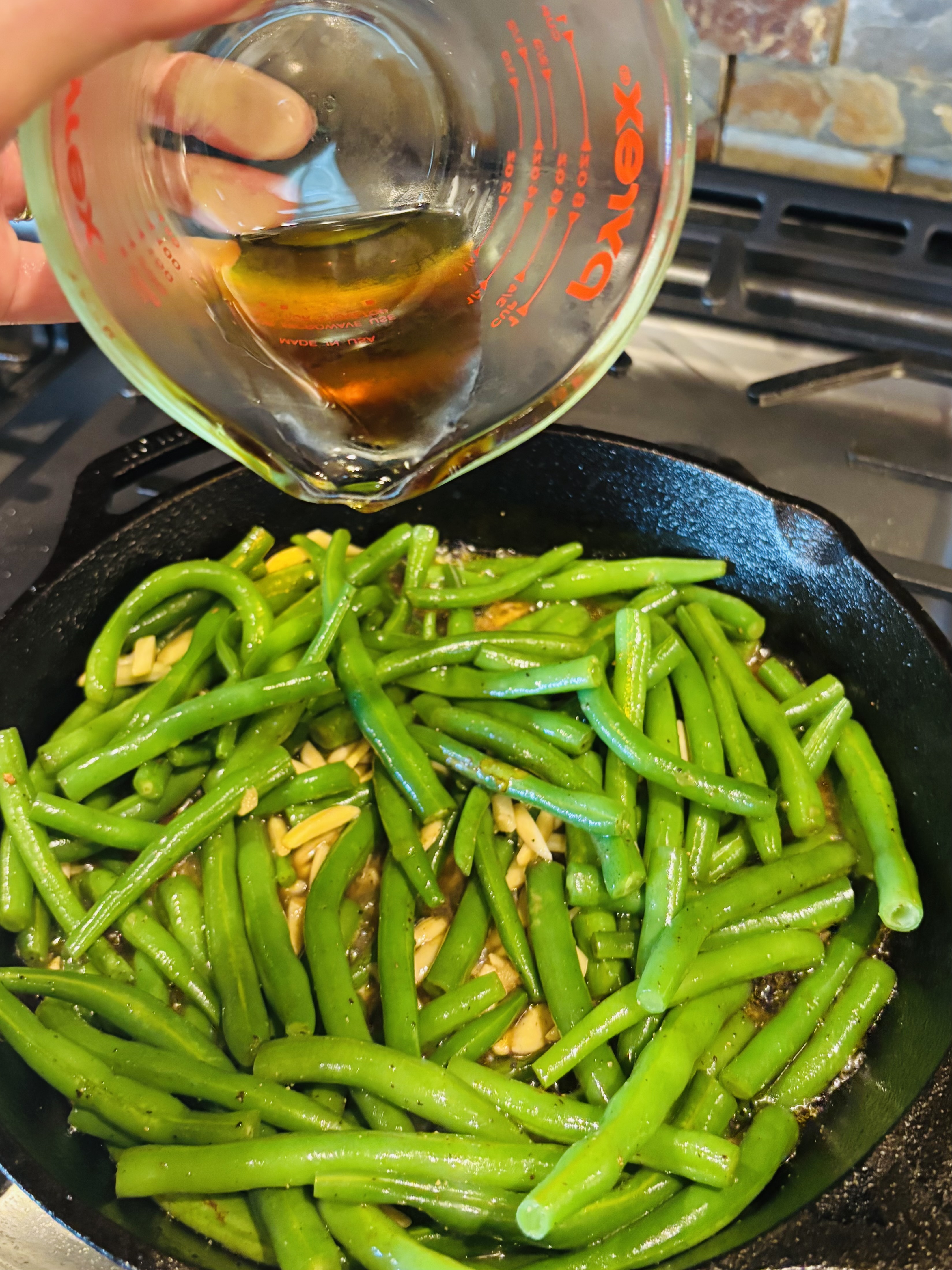 adding maple syrup to pan