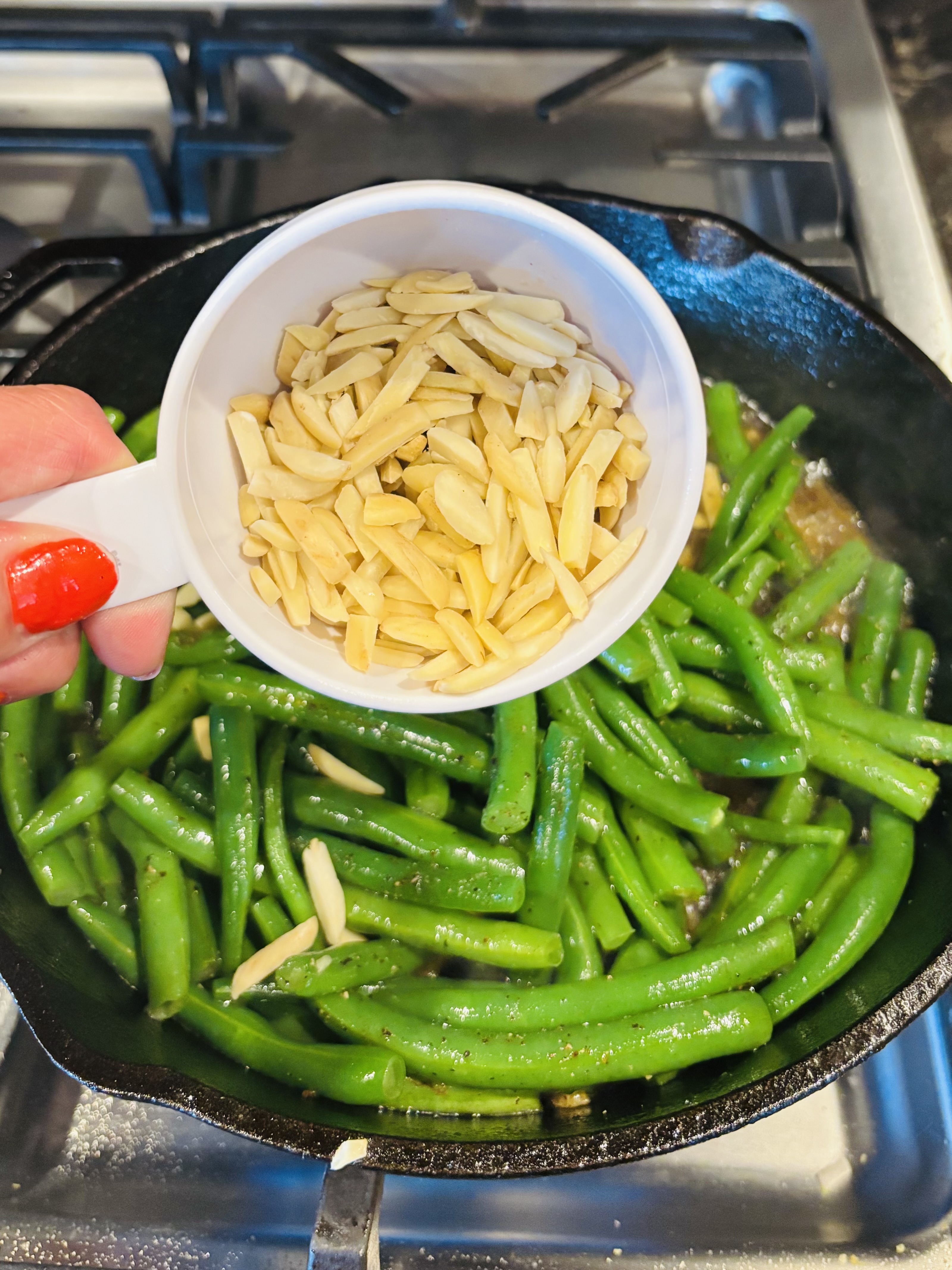adding almonds to pan