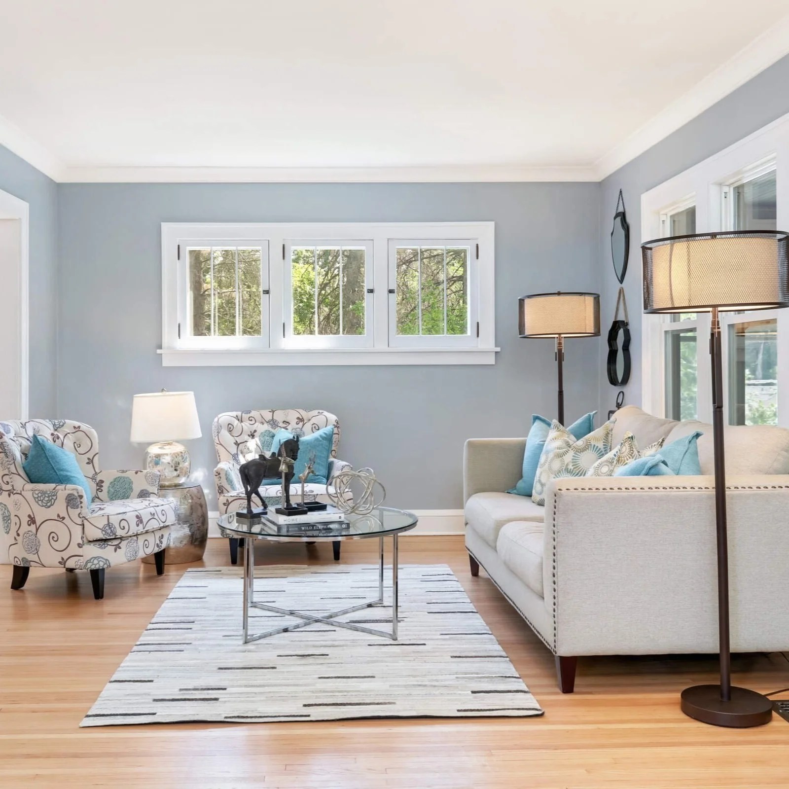 Renovated living room with refinished hardwood floors, Minnetonka farmhouse remodel by FORMA