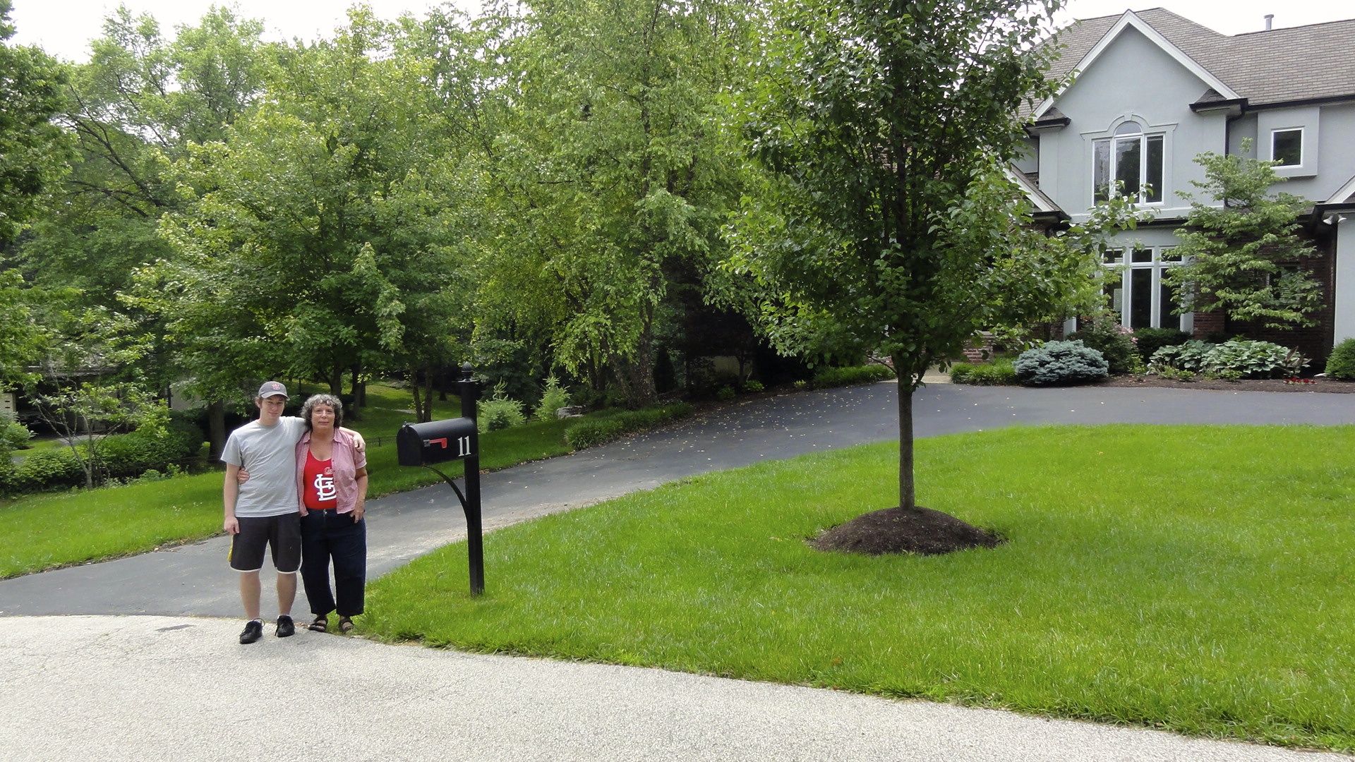 This is the site where Mom's old house stood. Her old house was torn down after we sold it and this million dollar mansion built in its place.