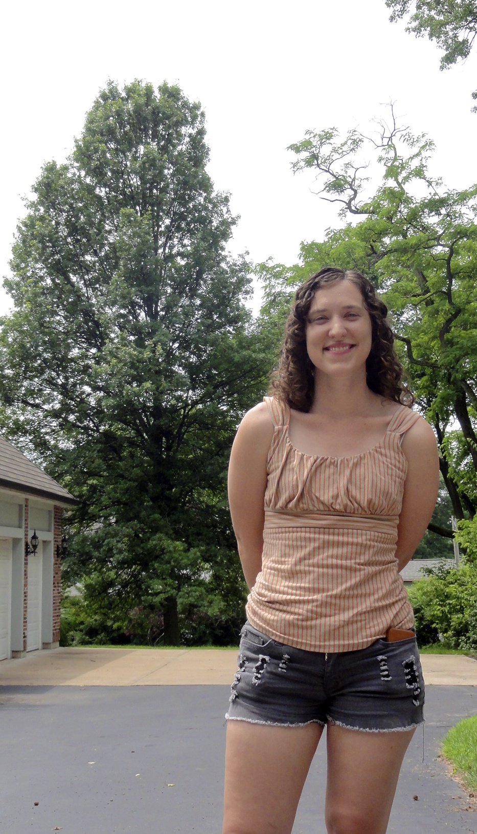 We think the tree behind me is the little pin oak sapling my mom planted in the back yard when I was little that I called "baby tree." Not so little any more!