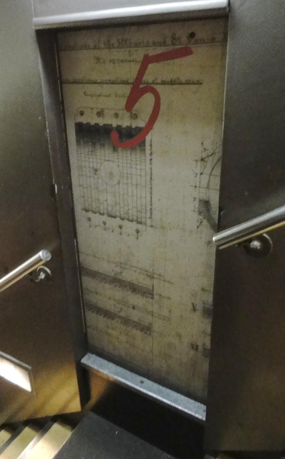 The doors to the tram cars that took you up and down the arch were decorated with images from the plans for the arch.