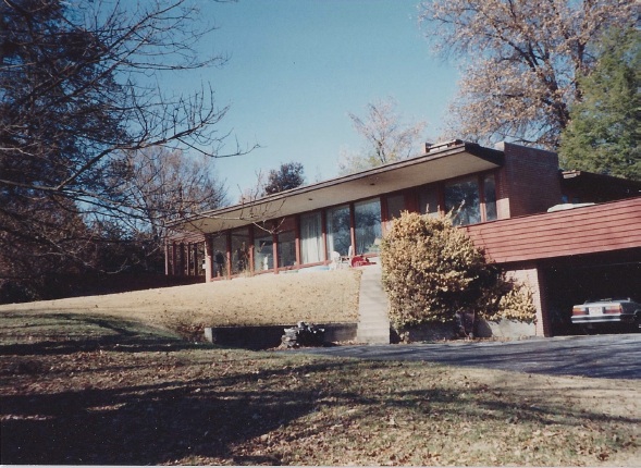 This is what the old house looked like (the house faced the back yard and you took the driveway down a hill and around back to get to this side). The house was built in 1948. My mom's parents hired their friend and neighbor Hari VanHoefen -- an architect who, like many in that era, was inspired by the minimalist, modern style of Frank Lloyd Wright -- to design the house. Mom still has a clipping of the newspaper article that was written about the house when it was built.