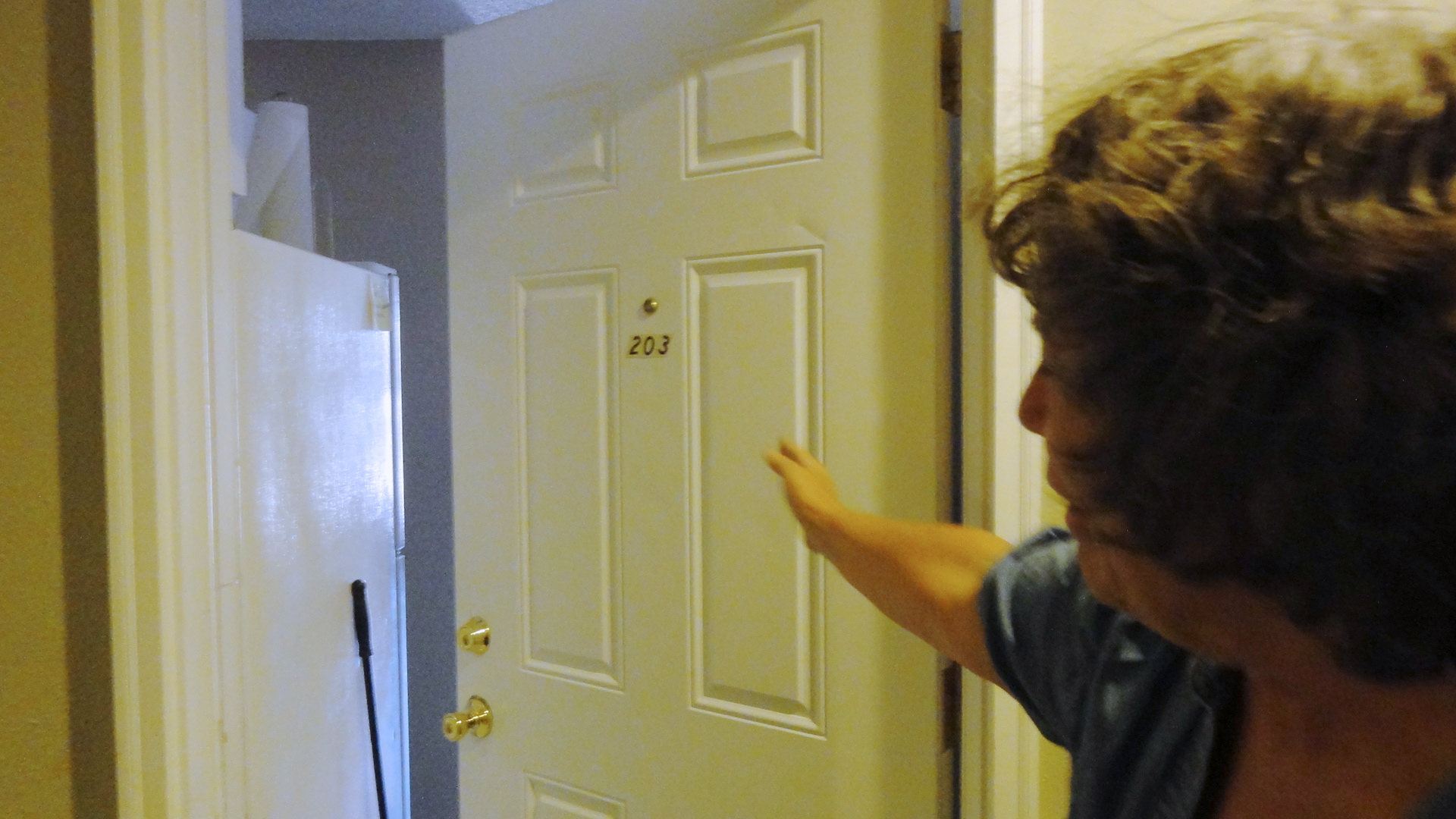 We were able to go inside the apartments (the door, marked with a sign saying "please close the door for security" was ajar, so we ventured upstairs and found the door to their old apartment also ajar. Here Mom is explaining how Dad built a partition complete with doors to divide the apartment into additional rooms. Mr. Rosecrantz came in one day to find the apartment unrecognizable, must have been thinking "well, there's one security deposit I'll get to keep." But he didn't know my dad -- when they moved out, everything was restored to exactly the way it was when they moved in.